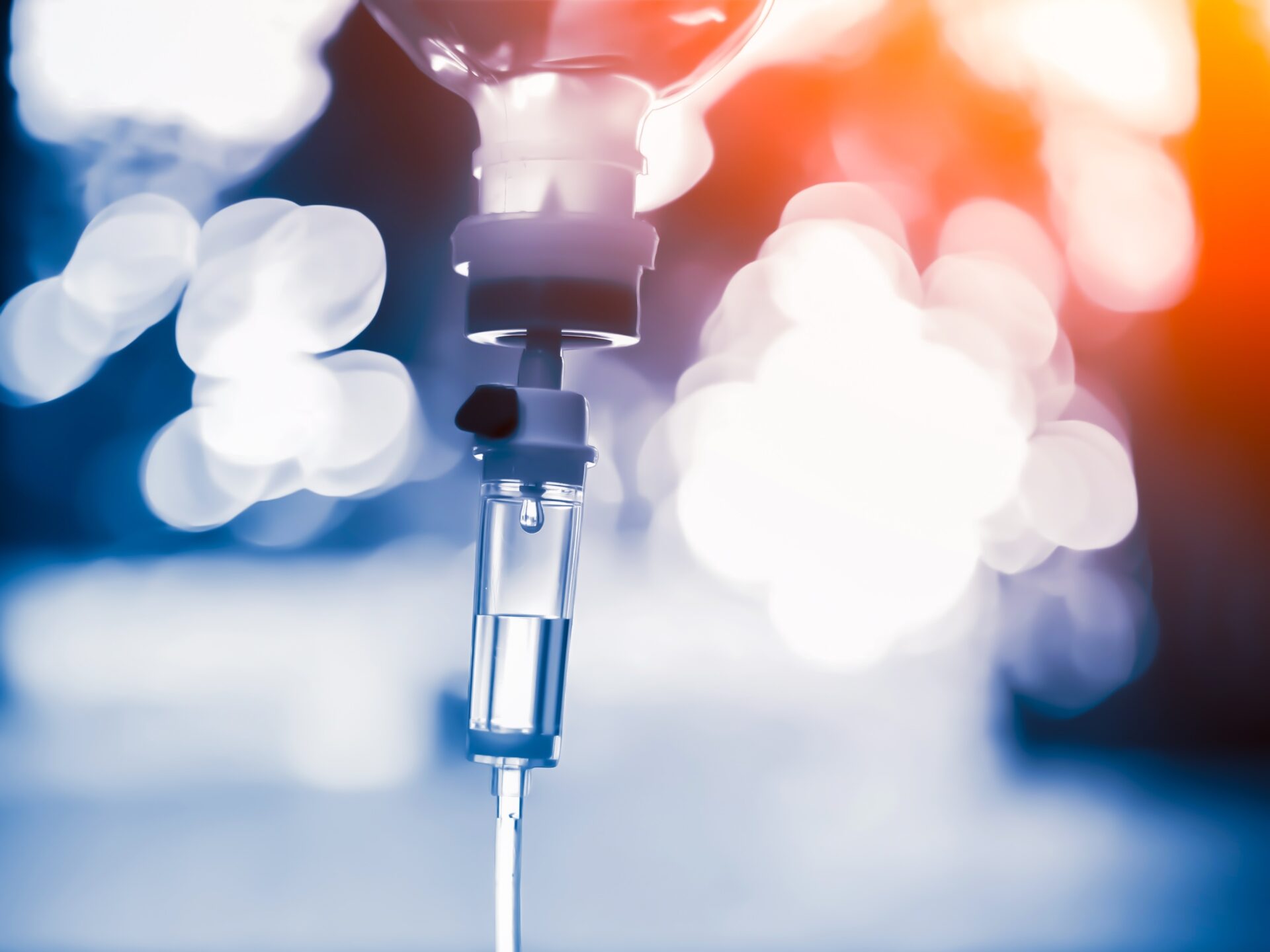 Vitamin,Nutriention,Iv,Drip,Therapy,Drug,Treatment,Concept.doctor,Use,Treatment A healthcare professional administers a syringe injection into the arm of a person lying down, showcasing a clinical setting.